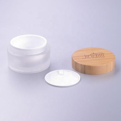 China 100g white acrylic jar with bamboo lid eco-friendly luxury custom cosmetic packaging eco-friendly for sale