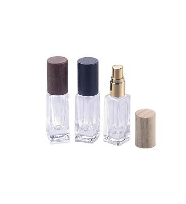 China Empty perfume bottle with spray pump perfume bottle wood cap for sale