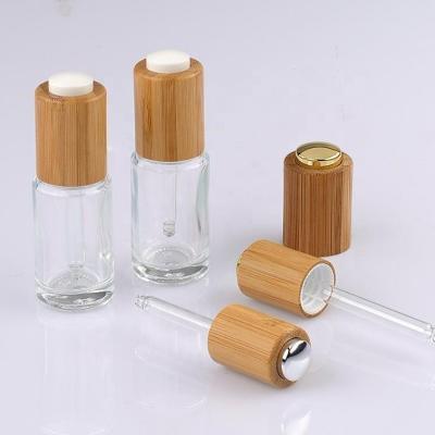 China bamboo lid cosmetic glass bottle for essential oil with bamboo dropper for sale