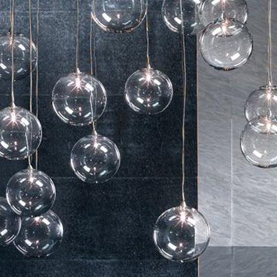 China Hot Selling Minimalist Customized Large Glass Ball Chandelier Hotel Villa Club Decoration Stairs Hanging Suspension Pendant Light for sale