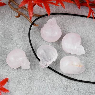 China China Folk Crafts Hand Cut Crystal Skulls Mini Crystal Rose Quartz Skulls for sale