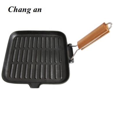 China Sustainable Cast Iron Square 24*24CM Grill With Foldable Wooden Handle for sale