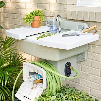 China Modern Widely Used Outdoor White Garden Sink With Hose Rack Reel Potting Station for sale