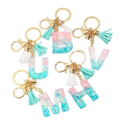 China 26 Word Plastic English Letter Key Chain, Z Handbag Charms Sparkle Glitter Shell Paper Resin Keychain Tassel A For Woman for sale