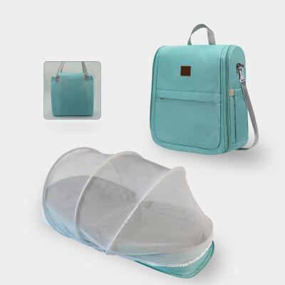 China Backpack Mommy Travel Bag Baby Drinking Hutch With Mosquito Mesh Folding Diaper Bags for sale