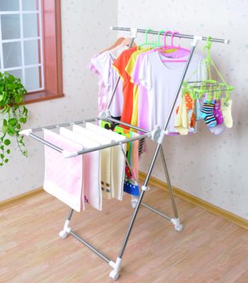 China Folding x shaped clothes rack for telescopic in stainless steel with wheels for sale