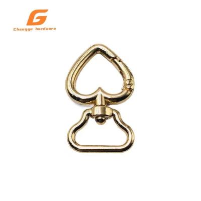 China New Fashion Metal Dog Buckle Peach Shaped Handbag Hardware Revolving Hook for sale