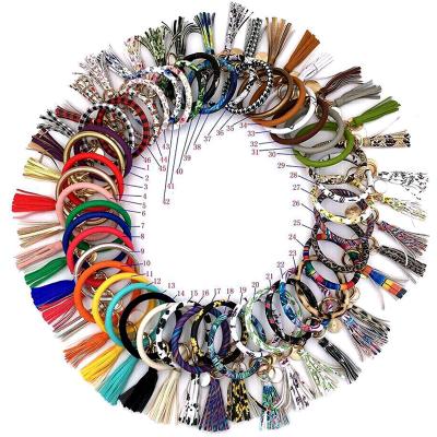 China FASHIONABLE Long Keyring Tassel Disc Monogram Key Chain O Shape Print PU Leather Wristband Bracelets for sale