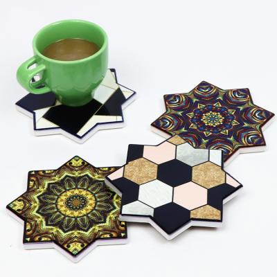 China OEM/ODM Viable Custom Wholesale Printing Star Shape Tea Coffee Kitchen Table Cup Mats And Ceramic Place Mat Coasters Set With Backing for sale