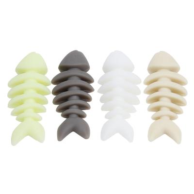 China Safe Stocked Bite Night Lights Silicone Bone Dog Chew Toy for sale