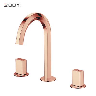 China ZOOYI Metered Faucets Rose Gold Polished Brass Bathroom Sink Basin Mixer Tap 3 Hole Water Tap for sale