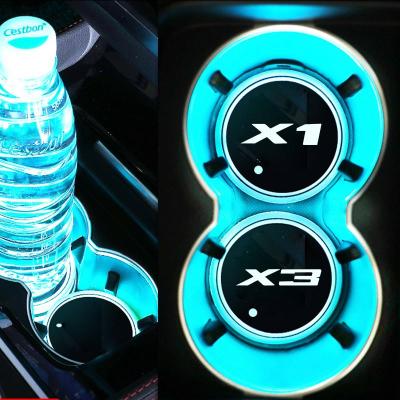 China Eco-friendly USB Charging LED Atmosphere Lights Car Logo Cup Holder Mat Bottle Coaster Set for sale