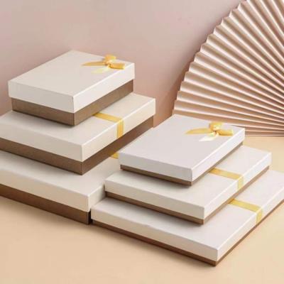 China Wholesale Custom Handmade White Gold Logo Premium Luxury Cardboard Paper Gift Packaging Box Customized Ribbon Art for sale