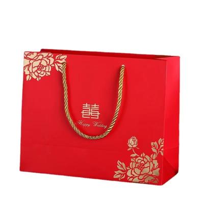 China Handmade Custom Paper Handbag With Logo Print Paper Red Handle Luxury Gift Bags With Logo for sale