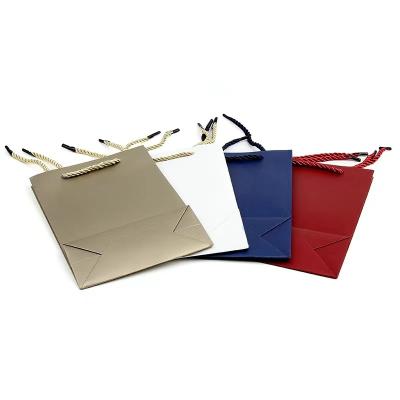 China Factory Price Handmade Blue Custom Shopping Bags With Logo Print Paper Handle Luxury Gift Bags for sale