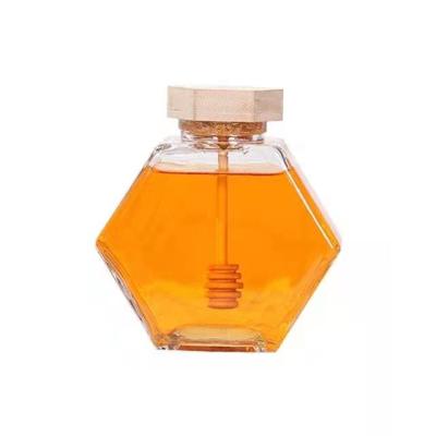 China China factory stocked wholesale imported wooden hexagonal lid 500ml honey glass container jar with lid for sale