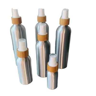 China Most Popular Cosmetic Empty Bamboo Bottle With Aluminum Black Spray Top for sale