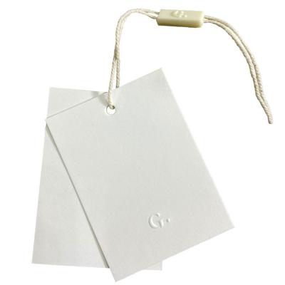 China Durable Luxury Thick Paper Hang Tag Garment Hanger Tag Cardboard Hang Tag with Strings for Garment and Bag for sale