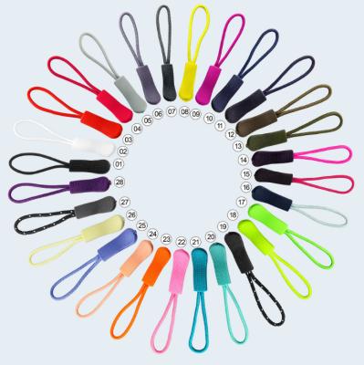 China Custom High Quality Eco-friendly Fancy PVC Relief LOGO Rubber Rope Zipper Puller for sale