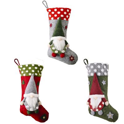 China Giant Santa Claus Red And White Nonwoven Fabric Christmas Stockings Ornaments Gift Bag for sale