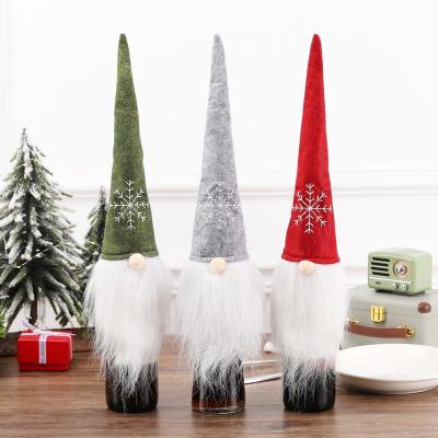 China Christmas Decoration European Style Christmas Grass Bottle Cover Non-woven Cover Winebottle Cover For Decoration for sale