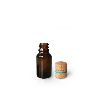 China 10ml Essential Oil Amber Glass Eco - Friendly Bottle With Unique Sustainable Cosmetic Packaging Bamboo Cap for sale