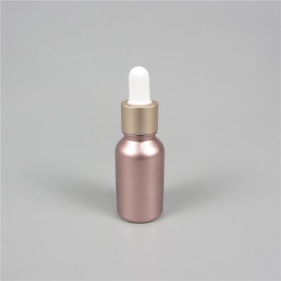 China Custom Pink Cosmetic Bottles Cylinder Glass Dropper Bottle Empty Glass Dropper Bottle for sale