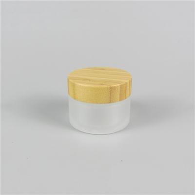 China Skin Care Creams Most Popular Round Wide Mouth Frosted Glass Cosmetic Bamboo Cream Jars With Your Logo for sale