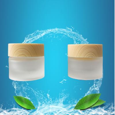 China Skin Care Creams 2021 Most Popular Mini Bamboo Cream Jar Frosted Glass Cosmetic Containers Jar 10g for sale