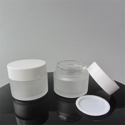 China Round 100ml frosted empty skin care cream make up cosmetic cream glass jars container with white lid for sale