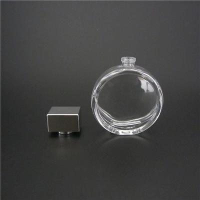 China Custom Round Personal Care Perfume Glass Bottle Glass Perfume Bottles With Silver Cap for sale