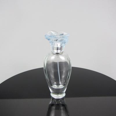 China Personal Care 50ml Empty Glass Perfume Bottle With Flower Cap Spray Bottle for sale