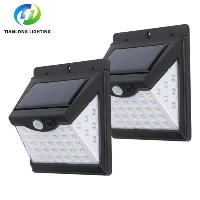 China Modern New Product Outdoor IP65 Sensor Waterproof ABS SMD 40w Outdoor Garden LED Solar Powered Wall Lamp for sale