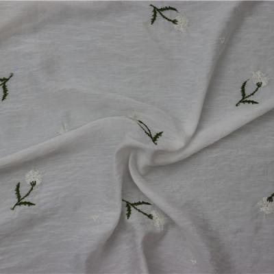 China Newest Delicate Anti Pill Green Plant Embroidery Textile Fabrics Sale Well Made Fabric for sale