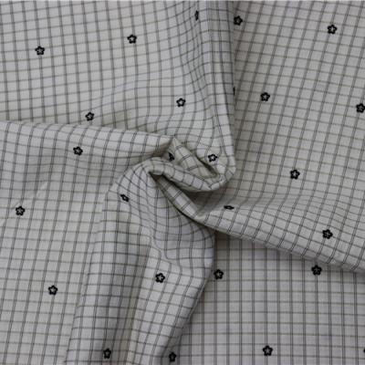 China Anti pill factory supply flower grid pattern fabric flocking avant-garde fashion elegant exquisite fabric for sale