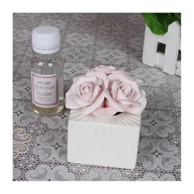 China Viable Essential Oil Ceramic Flower Vase Flower Rose Ceramic Aroma Diffuser Air Freshener for sale