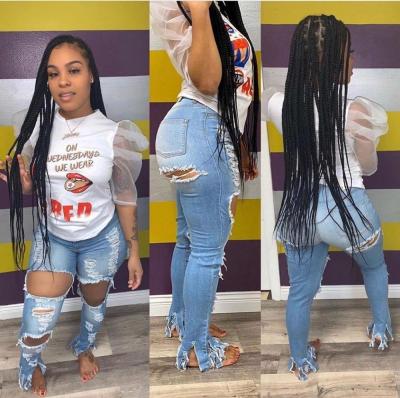 China 2020 Women Fashion Breathable Soft Jeans With Flowery Holes And Small Tassel Ripped Jeans Denim for sale