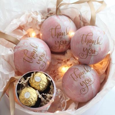 China Food Ins Style Chocolate Storage Metal Pink Ball Shaped Box Candy Tin With Ribbon for sale