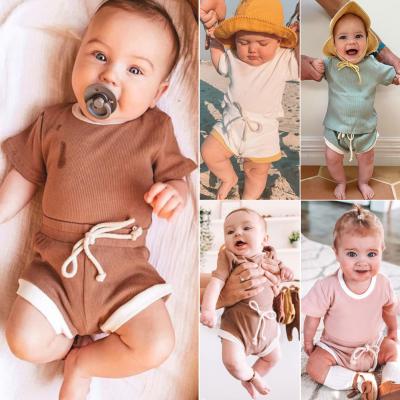 China 2021 Hot Breathable Style Solid Color Pit Strip Fabric 9 Colors Optional Short Sleeve Top and Shorts Two-piece Suit for sale