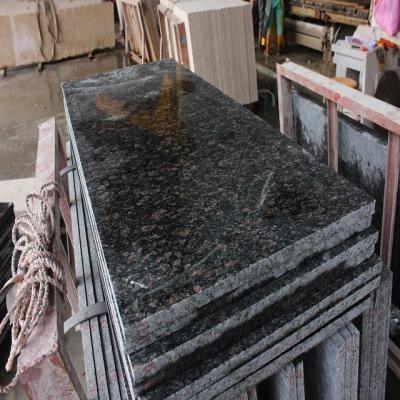 China Natural Tan Brown Granite Stone Wall Tile Manufacturer for sale