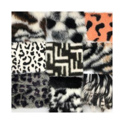 China High quality wholesale auto upholstery 100%polyester double color faux fur fabric running stock lots for garment for sale