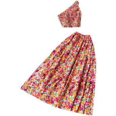 China Summer One Shoulder Sleeve Pleated Crop One Sets Floral Printed Ins Women's Sets Hot Sale Waterproof Tops Elastic One Piece Midi Line Skirt Two Piece Set for sale