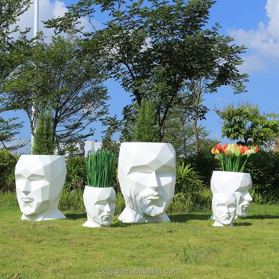 China Modern Hot Sale Man Face Large Fiberglass Planters Outdoor Resin Flower Pots for sale