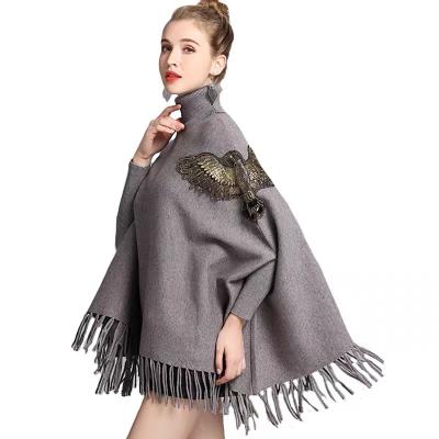 China Anti-Wrinkle OEM Double Roll Neck Tassels Cape Women Animal Sweater Knitting Glittery Shawls for sale