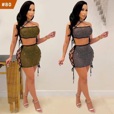 China 2022 New Arrival Mini Skirt Mesh Rhinestone Outfits Halter QUICK DRY Hollow Women Set Bandage See Through Mesh Sets 2 Pieces for sale