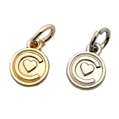 China Oil Covered To Prevent Fade Gold Custom Round Shape Charms Jewelry Tags Logo With Ring For Pendant for sale