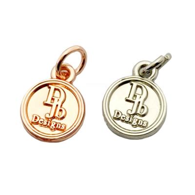 China Oil Covered To Prevent Fade Wholesale Customized Rose Gold Metal Branded Logo Jewelry Tag For Charm Pendant for sale