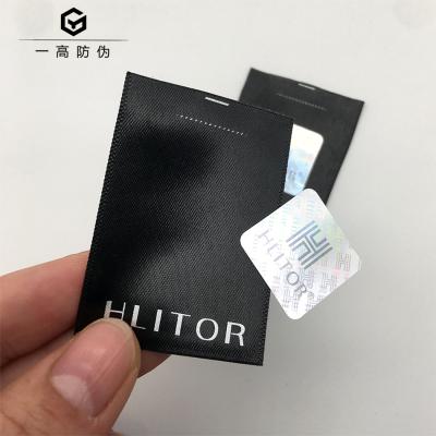 China Custom Washable And Wear Resistance Laser Washable Holographic Security Labels Stickers For Clothing Products for sale