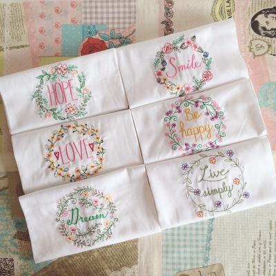 China Sustainable Cotton Napkin Home Kitchen Cooking Small Table Napkin Decor Embroidered Table Mat With Embodied Flower for sale