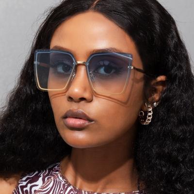 China Oversized Metal Cat Eye Sunglasses For Women Rimless Fashion Rimless Gradient Dropshipping S21104 for sale